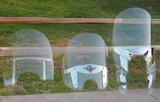 The Harley windshield (left) and the Yamaha Windhield (right) pop off in a few seconds without any tools. The Kawasaki shield (center) requires a few minutes with an allen wrench.